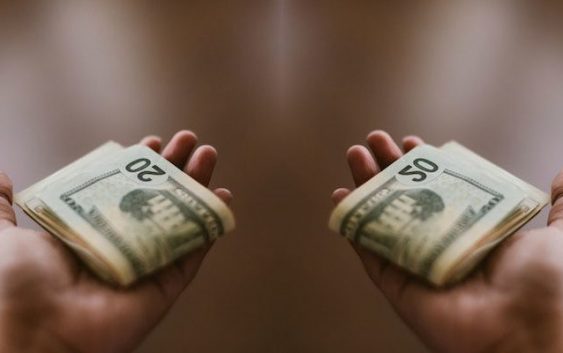 Where does a Christian take money to the church?